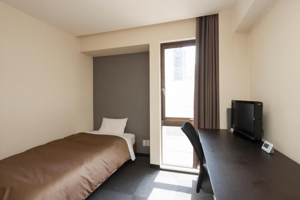 Hotel Plaza Inn Tokushima Værelse billede