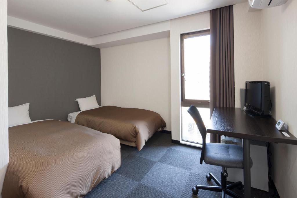 Hotel Plaza Inn Tokushima Værelse billede